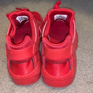 Red Nike shoes, size 6.5 in youth.